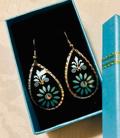 Elegant, handcrafted, cooper engraved Turkish earrings.  These Turkish handmade earrings are a perfect gift for someone special. Crafted from high-quality copper, they feature an intricate engraving that adds a touch of beauty to any outfit. The earrings are perfect for those who appreciate unique and exquisite jewelry pieces. The earrings are designed with a focus on beauty and elegance, making them a great addition to any jewelry collection. The engraved design adds a touch of sophistication to the overall look, making them perfect for both casual and formal occasions. These earrings are sure to impress and make a great statement piece. Engraved Metal Earrings For Gift, Engraved Metal Earrings As Gift, Artistic Etched Earrings As A Gift, Handmade Bronze Earrings As Gift, Handmade Bronze Earrings For Gift, Artistic Hand Painted Copper Earrings, Teardrop Bronze Earrings For Gift, Bronze Teardrop Earrings For Gifting, Bronze Teardrop Earrings For Gifts