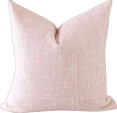 a pink pillow on a white background