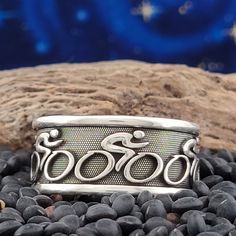 "Another fun bicycle ring that expresses our new passion for bicycling here in the desert southwest. A bicycle rider flying down the road with a few of their friends. Perfect for the cyclist in your life! NOTE: * - If you would like to see more rings like this, please check out our \"HOBBIES & SPORTS\" section. CRAFTSMANSHIP and MATERIAL OPTIONS This design is rich in detail and the deeply carved pattern will last a lifetime. The detail runs around the entire band. This ring is solidly crafted i Wedding Bike, Hobbies Sports, Bicycle Chainrings, Bicycle Wedding, Bike Jewelry, Desert Southwest, Man Bike, Bike Rider, Cool Bicycles