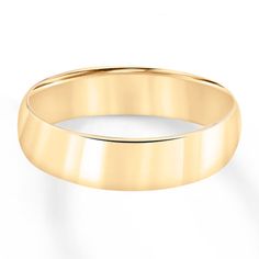 a yellow gold wedding ring on a white background with clipping path to the top