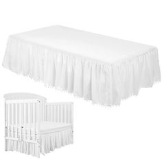 a white crib and bedding set on a white background