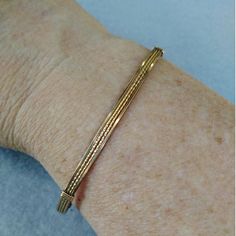 A pretty little bracelet of four strands of 14kt gold filled wire--two twist in the middle and two plain square on either side. So sweet and feminine! This one stacks nicely with a number of my other bangle-style bracelets! The sturdy built-in hook and eye clasp is easy to get on and off by yourself. Choose your size for a perfect custom fit! This design is also available in sterling silver and two-tone. Add on a jewelry polishing cloth to keep your bracelet--and ALL your jewelry--shiny clean! h Dainty Adjustable Jubilee Bangle, Dainty Adjustable Jubilee Bracelet Bangle, Dainty Adjustable Cuff Bracelet With Jubilee Style, Elegant Jubilee Cuff Bracelet For Friendship, Classic Friendship Bangle Bracelets, Elegant Friendship Wrap Bracelet, Classic Bangle Bracelets For Friendship, Elegant Gold Hand Wrapped Stretch Bracelet, Adjustable Flexible Chain Bangle Bracelet