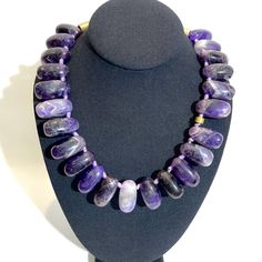 The necklace is made of irregularly shaped semi-precious Amethyst stone, showcasing the different shapes of purple called “Rose de France." The meaning of Amethyst has long been synonymous with spirituality and is famed for its close association with the third eye and the crown chakra.  Amethyst is the birthstone for February.   The necklace is 19 inches long and weighs 12 ounces. Resin And Clay, Purple Stone Necklace, Born In February, The Third Eye, Amethyst Stones, Purple Stones, Amethyst Necklace, Crown Chakra, Amethyst Stone