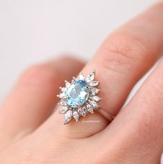 Gorgeous Vintage Inspired Aquamarine Ring ►Made of solid sterling silver with rhodium finish (925) ►Accented with simulated diamonds (CZ) ►Average band width: 2.1 mm ►Halo size: 17.5 mm x 13.1 mm Center Stone: Aquamarine Shape: Oval Gem size: 6.0 x 8.0 mm Carat Weight: 1.4 ct. (approx.) Gemstone creation: Lab-Grown Hardness: 8(Mohs scale) ✓ 100% Nickel-Free ✓ Hypoallergenic ✓ Comfort Fit ✓ Free Ring Box ✓ Free USA Shipping Marquise Topaz Ring With Center Stone For Wedding, Marquise Cut Topaz Wedding Ring With Center Stone, Fine Jewelry 14k White Gold Topaz Wedding Ring, Sterling Silver Topaz Halo Ring For Wedding, Sterling Silver Halo Topaz Ring For Wedding, Timeless Topaz Ring With Center Stone For Anniversary, Wedding 14k White Gold Topaz Ring With Prong Setting, Classic 14k White Gold Topaz Wedding Ring, Classic Wedding Topaz Ring With Marquise Cut