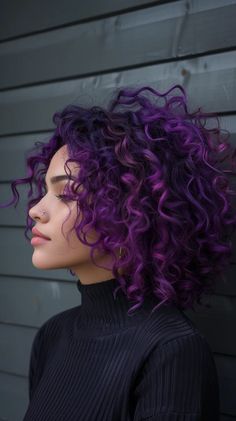 40 Prettiest Purple Hair Color Ideas To Make Your Hair Pop Purple Hair Over 40, Short Curly Hair Purple Highlights, Purple And Black Curly Hair, Curly Hair Color Ideas Purple, Dark Blue Purple Hair, Colored Curly Hair Ideas, Dark Purple Curly Hair, Lavender Curly Hair, Smokey Purple Hair