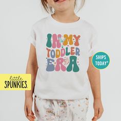 In My Toddler Era White Toddler T-Shirt, Birthday Graphic Tees, Gift for Birthday Girl PRODUCTION TIME Little Spunkies from the designer/owner of Spunky Pineapple Co https://www.etsy.com/shop/SpunkyPineappleCo   All baby and toddler clothes are 100% designed and printed with water based ink. All orders placed before 12:00 pm EST are shipped out same day (Monday - Friday). Orders received after noon are shipped out the next business day. T-SHIRT Made from 100% Cotton. These run true to size. If you are in between sizes we suggest sizing up. CARE Machine wash in cold water, inside out, and tumble dry.   SHIPPING All orders are shipped out via USPS First Class Mail (3-4 days).   Shipping upgrades are available at checkout: *USPS Priority Mail (2-3 days) *USPS Express Mail (1-2 days) *FedEx 2 Gift For Birthday Girl, Birthday Graphic, Kids Graphic Tees, Baby And Toddler, Toddler Clothes, Toddler Tees, Gift For Birthday, Birthday Girl, Cute Shirts