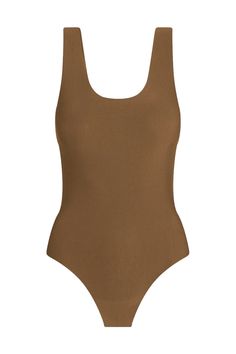 Description This Butter Tank Bodysuit features next-level softness and supreme stretch from European modal. It features an ultra-flattering fit and is finished with a raw-cut thong bottom. All About the Fit Fabric Feel (light) 1 2 3 4 (heavy) Fit (slimfit) 1 2 3 4 (loosefit) Fabric Details: Luxury Austrian modal blend (79% modal, 21% elastane) Fit-tested by real women Elastic-free construction Four way stretch and high recovery Pilling resistant Raw-cut edges Snap gusset closure Machine washable Fitted Elastane Swimwear With Soft Touch, Smoothing Bodysuit With Minimal Stretch For Loungewear, Fitted Soft Touch Swimwear For Summer, Fitted Bodysuit For Lounging, Seamless Solid Bodysuit For Lounging, Seamless Solid Color Bodysuit For Lounging, Fitted Beachwear Swimwear For Lounging, Scoop Back Swimwear With Minimal Stretch, Second-skin Elastane Bodysuit For Loungewear