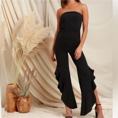 Nwt Black Lulus Jumpsuit Size Small Strapless Ruffled Jumpsuits And Rompers For Date Night, Black Sleeveless Ruffled Jumpsuit, Sleeveless Black Ruffled Jumpsuit, Sleeveless Black Jumpsuit With Ruffles, Sleeveless Black Ruffled Jumpsuits And Rompers, Strapless Sleeveless Ruffles Jumpsuit For Date Night, Black Sleeveless Flirty Jumpsuit, Black Sleeveless Flirty Jumpsuits And Rompers, Solid Evening Jumpsuits And Rompers With Ruffles