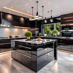 a modern kitchen with black cabinets and stainless steel counter tops is pictured in this image