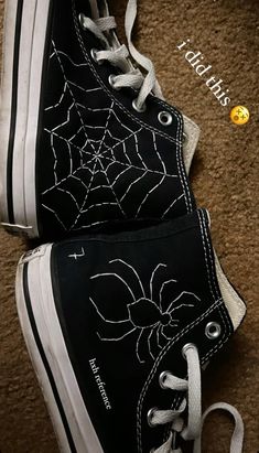 black and white shoes with spider web on them