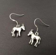 Dainty Donkey Charm Earrings!  A sweet three dimensional donkey charm on a lovely french hook makes the perfect gift for you or your best friend.  The dangle earrings are perfect for weddings, birthdays, or any special occasion. The cowgirl charm is made from zinc alloy and measures 17 mm by 15 mm.  The french hooks are stainless steel and measure 20 mm by 17 mm.  The donkey charms are reversible and the charms will face opposite ways.Each pair of earrings arrives in its own gift box, perfect fo Cowgirl Earrings, Kitten Earrings, French Hook Earrings, The Donkey, Animal Earrings, Cow Girl, Cat Earrings, Clay Charms, Charm Bangle