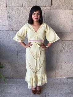 "Very rare Mexican dress, definitely a unique piece. zipper up. Made in 1970's Light Yellow pintuck cotton, you can see through it. Gorgeous details with lace. Fits size Small Measurements taken flat: Armpit to Armpit 18 1/4\" Waist 15\" HIps 19\" Bottom hem width 33 1/2\" Shoulders to bottome hem 50 1/2\"" Spring Festival Dress With Lace Sleeves, Summer Lace Work Maxi Dress, Bohemian Festival Dresses With Lace Sleeves, Bohemian Maxi Dress With Lace Sleeves For Spring, Spring Bohemian Maxi Dress With Lace Sleeves, Fitted Maxi Dress With Chikankari Embroidery, Floor-length Lace Dresses For Spring, Fitted Chikankari Embroidery Maxi Dress, Bohemian Fitted Lace Dress With Ruffles