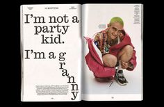 an open magazine with a man wearing a red jacket and green hair sitting on the floor