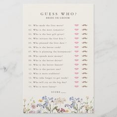 the guess game for brides is shown on top of a marble table with flowers