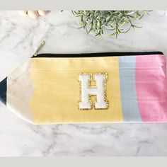 Get this cute custom letter pencil pouch for teacher appreciation gift. This is the perfect teacher accessory bag. Want to make it a gift box? Click on the link below for the gift box listing: https://wild4style.etsy.com/listing/1725430682 Include more teacher items with the pouch. Click on our bestsellers in teacher accessories below to add to your order. 🍎 Cute Teacher Studs: https://wild4style.etsy.com/listing/1515701279 📝 Notepad & Pen: https://wild4style.etsy.com/listing/1700480148 ✏ Penc Back To School Bag With Pen Holders, Multicolor Pencil Case For End Of School Year, Pink Craft Supplies For End Of School Year Gift, Customizable Educational Craft Supplies For Gifts, Educational Craft Supplies With Pen Holders For Gift, Pink Pencil Case For End Of School Year Gift, End Of School Year Personal Zipper Pouch Pencil Case, End Of School Year Zipper Pouch Pencil Case, Educational Craft Supplies For Personal Use