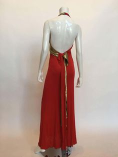 For Sale on 1stDibs - Giorgio Sant'Angelo 1970's Red Jersey Halter Dress with Gold Lame Bust Detail. *ALL MEASUREMENTS TAKEN FLAT* Armpit to armpit: 30' Waist: 26' Hips: 34' Vintage Fitted Maxi Dress For Gala, Red Sleeveless Vintage Maxi Dress, 1970s Red Summer Dresses, 1970s Style Red Summer Dresses, Red 1970s Style Summer Dress, Fitted Red Vintage Evening Dress, Vintage Red Fitted Evening Dress, 1970s Style Summer Evening Maxi Dress, 1970s Style Maxi Dress For Summer Evening