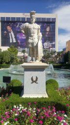 there is a statue in front of a building