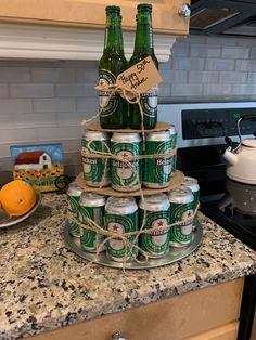 a stack of beer cans sitting on top of a counter