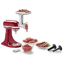 an electric meat grinder is shown with several bowls and spoons