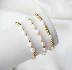 💫  14k gold filled beaded bracelet stack. Made with mini freshwater pearls. You will receive 3 bracelets with the same pattern above. 💫  Minimalist style with a beautiful elegant pearl and gold color palette. 💫 These elegant bracelets are perfect for weddings, bridesmaid gifts and for engagement gifts. Delicate stacking bracelets to elevate any outfit. ���💫  4mm gold filled beads with 5mm mini freshwater pearls.  Strung on a premium stretch cord, my classic elegant 14k gold filled bead bracelet Gold Color Palettes, Freshwater Pearl Bracelet, Elegant Bracelet, Christmas Gifts For Her, Wedding Bracelet, Bracelet Stack, Engagement Gifts, Pearl Bracelet, Cute Jewelry