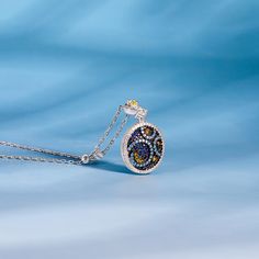 In a stunning display of style and craftsmanship, this necklace is brought to you. A combination of light blue, midnight blue, yellow gold, and white stones, the necklace is a premium miniature version of Van Gogh's timeless Starry Night painting. This piece of work reminds us to trust our dreams and not believe the critics of the world. "There is always hope, even in the darkest of times." So trust your dream and let this alluring jewelry make a statement.Carat Weight: 2.807 ctStone Size: 1,2,3 Luxury Blue Pendant Necklace, Luxury Blue Round Pendant Necklace, Fine Jewelry Blue Flower Pendant Necklace, Blue Flower Pendant Fine Jewelry Necklace, Fine Jewelry Blue Necklace With Flower Pendant, Luxury Blue Sterling Silver Necklace, Exquisite Blue Sterling Silver Necklace, Jeulia Jewelry, There Is Always Hope