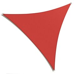 a red triangle flag hanging on the side of a white wall in front of a white background