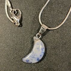 Sodalite Crescent Moon Chakra Pendant On 18" 925 Silver Plated Snake Chain. Sodalite Chakra Helps With Mental Clarity, Meditation, Self Awareness And Self Expression, Communication, And Brings Good Luck And Wealth. Sodalite Assist In Determining Your Life's Purpose And Direction In Life. It Integrates Logic And Intuition. Sterling Silver Pendant Crystal Necklace With Moon Charm, Sterling Silver Crystal Pendant Necklace With Moon Charm, Healing Sterling Silver Moon Necklace, Celestial Silver Gemstone Crystal Necklaces, Handmade Silver Sodalite Necklaces, Silver Crescent Gemstone Necklace, Handmade Silver Sodalite Necklace, Celestial Silver Crystal Necklace With Natural Stones, Silver Lapis Lazuli Round Pendant Necklace