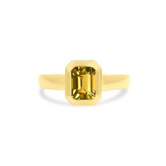 This ring is a perfect way to show off a birthstone! Your choice of a solitaire, emerald cut gemstone in a 14K yellow gold bezel setting on a tapered gold band. With this ring, you'll want to reach for this everyday as the perfect pop of color. Clean Candle, Engagement Ring Wedding Band, Custom Engagement Ring, Jewelry Case, Gold Band, White Topaz, Cleaning Jewelry, Bride Gifts, Bezel Setting