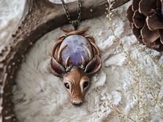 » One-of-a-kind deer pendant with an amethyst crystal 𝗦𝗜𝗭𝗘 Pendant: 3.5" inches Necklace Length: 10"  inches 𝗦𝗛𝗜𝗣𝗣𝗜𝗡𝗚 Necklace will come in bubble wrap, and be packaged in an upcyclable fabric bag. Small Packet™ does not come with tracking. If you would like a tracked package, select from one of the other available options. ---- Thanks for stopping by! If you have any questions, feel free to contact me through my main shop page. ★ Please read my Shop Policies and FAQ for additional i Deer Totem, Gifts For Witches, Deer Pendant, Totem Necklace, Witchy Necklace, Goth Cottagecore, Deer Jewelry, Cottagecore Gifts, Deer Necklace