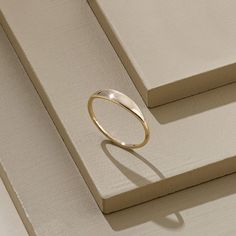 The Tiny Signet Ring is the pinnacle of minimalist design and elegant rings. Its plainness with glamorous modesty will fascinate people around you. It is perfect for everyday use and ring stacking. - Made in 14k Solid Gold - Band Width: 1.26 mm / 0.04 inches- Top Width: 3.30 mm / 0.12 inches- Thickness: 1.06 mm / 0.04 inches - This product comes with iconic Norm Jewels gift box Modern Stackable Toe Rings For Promise, Elegant Everyday Initial Ring With Simple Design, Simple Stackable Open Band Rings, Everyday Initial Ring With Simple Round Band, Minimalist Polished Promise Ring, Minimalist Promise Ring With Polished Finish, Simple Engraved Open Ring For Everyday Wear, Simple Engraved Open Ring For Everyday, Dainty Midi Rings With Polished Finish For Everyday