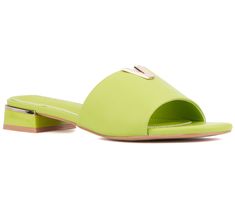 Step into the season with flair in this fashion-forward flat sandal that catches the eye with gleaming metallic V hardware, adding a touch of elegance to your spring and summer ensembles. From Torgeis. Green Flat Sandals For Evening, Open Toe Slides For Spring Parties, Spring Evening Open Toe Slides, Evening Slides For Summer, Spring Evening Slides, Summer Evening Slides With Flat Heel, Elegant Flat Heel Slides For Spring, Slide Flats For Spring Vacation, Trendy Green Flats For Spring