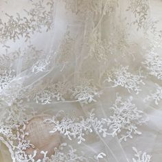 Embroidered White Lace In Organza, White Embroidered Organza Lace, Embroidered White Organza Lace, White Tulle Fabric With Lace Patchwork, White Lace Trim Tulle, White Tulle Lace With Patchwork, White Tulle Lace With Lace Patchwork, White Lace With Floral Embroidery In Tulle, Delicate White Lace Tulle Fabric