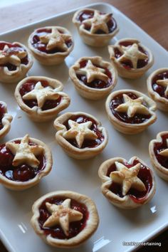 small pies with stars on them sitting on a tray