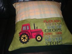 a pillow that has a tractor on it