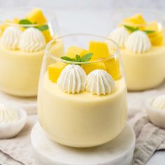 three desserts in small glass dishes on a table