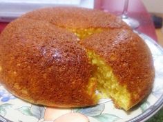 a bundt cake with one piece cut out on a plate