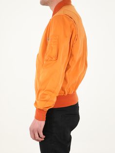 Long-sleeved orange jacket. It features front zip closure, two side buttoned flap pockets, one zipped pocket on left sleeve and contrasting details on neck, cuffs and hem. The model is 184cm tall and wears size 48. Size nationality: IT Product number: 35774814 Product code: 22CTCUC04064A06105434 Composition: 60% polyester, 40% polyamide Urban Orange Long Sleeve Outerwear, Urban Orange Outerwear For Fall, Orange Collared Outerwear For Work, Collared Orange Outerwear For Work, Orange Long-sleeve Outerwear With Pockets, Orange Long Sleeve Outerwear With Pockets, Orange Long Sleeve Outerwear For Work, Paul Harvey, Orange Jacket