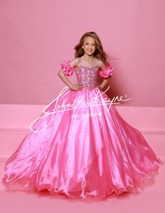 Dazzle on stage with the Sugar Kayne C359 pageant ballgown dress. Featuring a sweetheart neckline, puff sleeves, and spaghetti straps, this dress will make you stand out. With an embellished bodice and a glitter tulle and organza long skirt, you'll sparkle and shine like a true pageant queen. Colors: Capri Blue, Rose Pink, White Sizes: 2-16