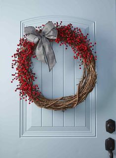 a wreath is hanging on the front door