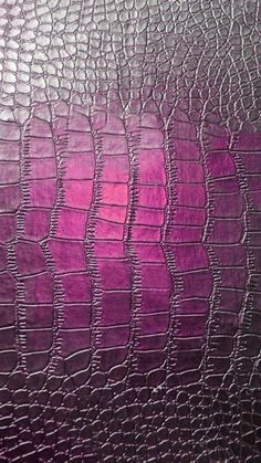 an image of purple leather textured with crocsants and alligator skin pattern