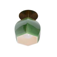 a green and white ceiling light with a brown metal fixture on the top of it