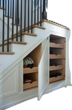 an under the stairs storage area for shoes