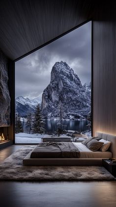 a bedroom with a mountain view is shown in this image, it appears to be very dark