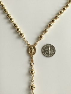 "18k gold over 925 sterling silver italian rosary 24\" long . for protection and good luck made in italy 6 mm beads gr:34.4 rosario de 925 plata esterlina con 18k bano de oro 24\" largo . para proteccion y buena suerte . hecho en italia 6 mm beads gr: 34.4" Elegant Gold Rosary For Anniversary, Elegant Gold Anniversary Rosary, Gold Round Beads Rosary As Gift, Gold Rosary With Round Beads As Gift, Gold Spiritual Rosary Bracelet With Polished Beads, Classic Gold Necklace With 8mm Beads, Elegant Jewelry With Miraculous Medal And Round Beads, Gold Necklaces With 8mm Beads For Spiritual Style, Gold Necklace With Miraculous Medal And Round Beads