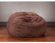 a large bean bag chair sitting on top of a hard wood floor