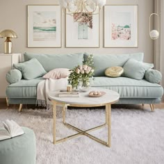 a living room with blue couches and pictures on the wall above them, along with a coffee table