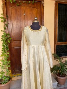 Traditional Anarkali suit usa /cream anarkali hand embroidery dress / pure chanderi handloom dress with embroidery  /Hanloom dresses / voggish /white anarkali  dress / pure silk dress          Looking for a perfect indian dress/anarkali/suit sets that are trendy, unique and easy to carry !! yess, You are at the right place. we carry such versatile pieces of anarkalis and suit sets, kurtas that really let you stand out in any occassion !!      featuring this beautiful pure handloom chanderi anarkali dress in pearl white color with hand embroidery at the neck and sleeves as shown !! A very classy, beautiful yet traditional , perfect and super comfy for any occasion !! Ready to ship , Can be customized in colors and patterns !! this set comes with chudi pants as shown in the picture!! Details Long Sleeve Chanderi Anarkali Set With Dori Work, Long Sleeve Raw Silk Kurta With Gota Work, Designer Long Sleeve Anarkali Set With Resham Embroidery, Off White Anarkali Gown With Dupatta, Anarkali Long Sleeve Kurta With Gota Work, Festive Long Sleeve Salwar Kameez With Gota Work, Anarkali Kurta With Gota Work And Long Sleeves, Festive Salwar Kameez With Gota Work And Long Sleeves, Off White Raw Silk Anarkali Dress