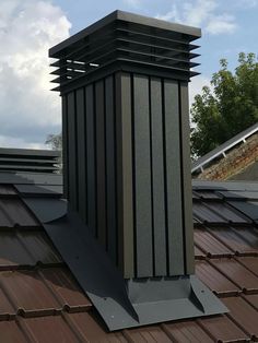 a chimney on top of a metal roof