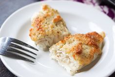 two pieces of food on a plate with a fork