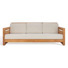 a wooden couch with white cushions on it